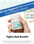 Hand holding BioGaia Prodentis Fresh Breath probiotic lozenges bottle with zinc, with promotional badge visible on the packaging.